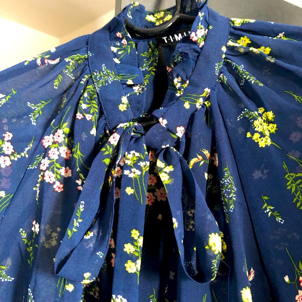 Flowered flowy tie neck blouse
